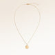 Full round gold necklace with white zirconia laid out flat with a fine adjustable gold chain and round pendant for personalised engraving
