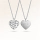 Personalized heart-shaped silver necklace with rippled wave surface and space for engraving of text, coordinates or handwriting on the back