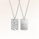 Personalized square silver necklace with rippled wave surface and space for engraving of text, coordinates or handwriting on the back