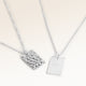 Personalized square silver necklace with rippled wave surface and space for engraving of text, coordinates or handwriting on the back