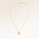 Full round necklace in gold fully laid out with fine adjustable gold chain and minimalist pendant for personalized engraving