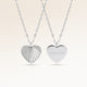 Personalized heart-shaped silver necklace with ribbed sunburst pattern and space for engraving of text, coordinates or handwriting on the back