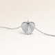 Personalized heart-shaped silver necklace with ribbed sunburst pattern and space for engraving of text, coordinates or handwriting on the back