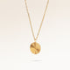 Round gold necklace with ribbed sunburst pattern side view, space for engraving on back
