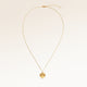 Full round necklace in gold fully laid out with fine adjustable gold chain and minimalist pendant for personalized engraving