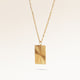 Square gold necklace with ribbed sunburst pattern side view, space for engraving on back
