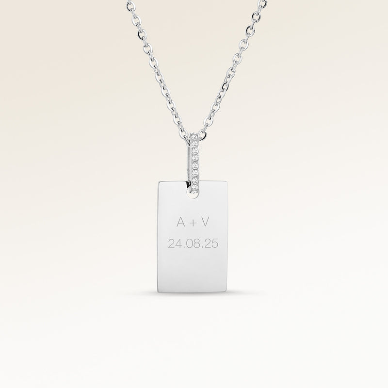 Personalized square silver necklace with white zircons and space for engraving of text, coordinates or handwriting on the front and back