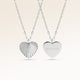 Personalized heart-shaped silver necklace with ribbed sunburst pattern and space for engraving of text, coordinates or handwriting on the back