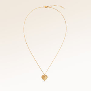 Heart-shaped necklace in gold fully laid out with fine adjustable gold chain and minimalist heart pendant for personalized engraving.