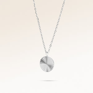 Round silver necklace with ribbed sunburst pattern side view, space for engraving on back