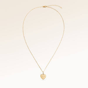 Full heart-shaped necklace in gold fully laid out with fine adjustable gold chain and minimalist heart pendant for personalized engraving